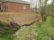 Redi-Rock retaining wall substantially complete