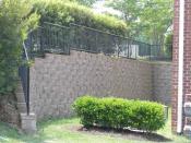 Retaining wall at corner of apartment building